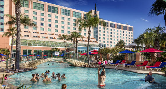 Moody Gardens Hotel and Pool image with guests enjoying the summer day